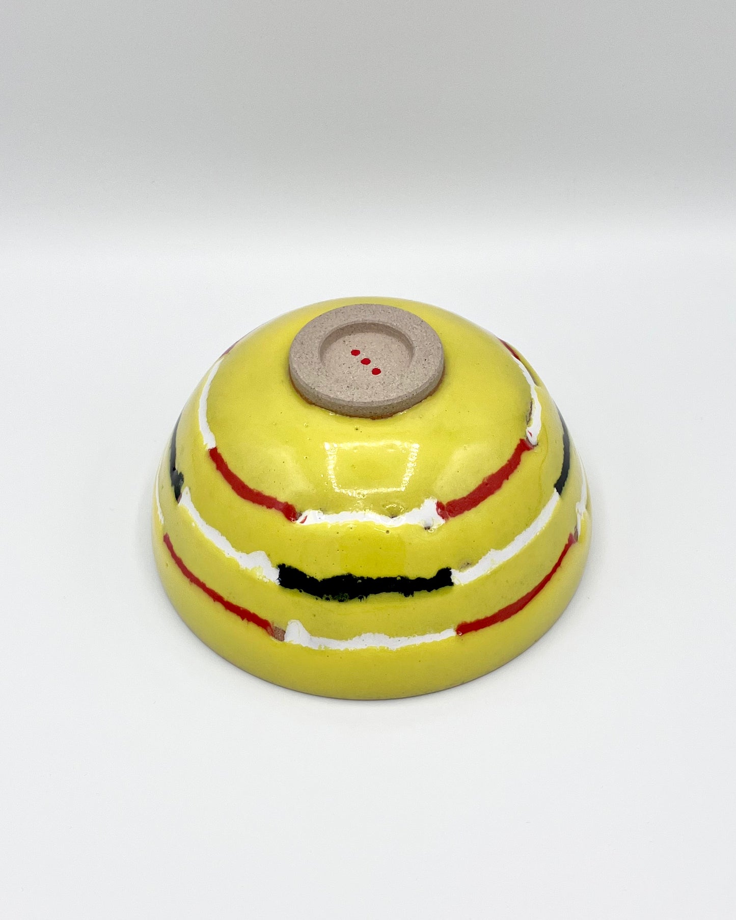 Yellow, red, white, black breakfast bowl