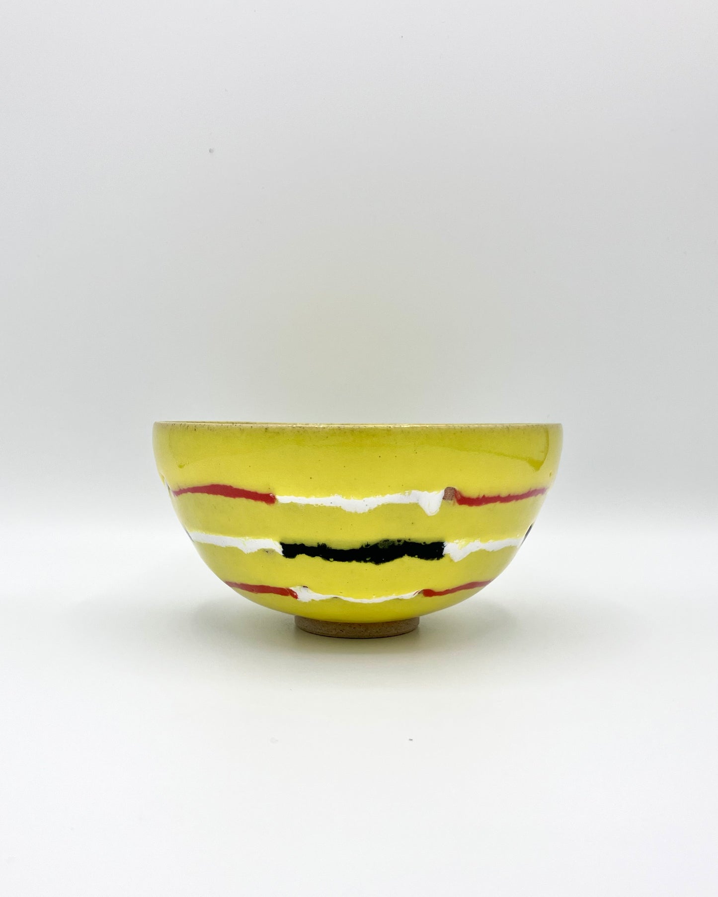 Yellow, red, white, black breakfast bowl