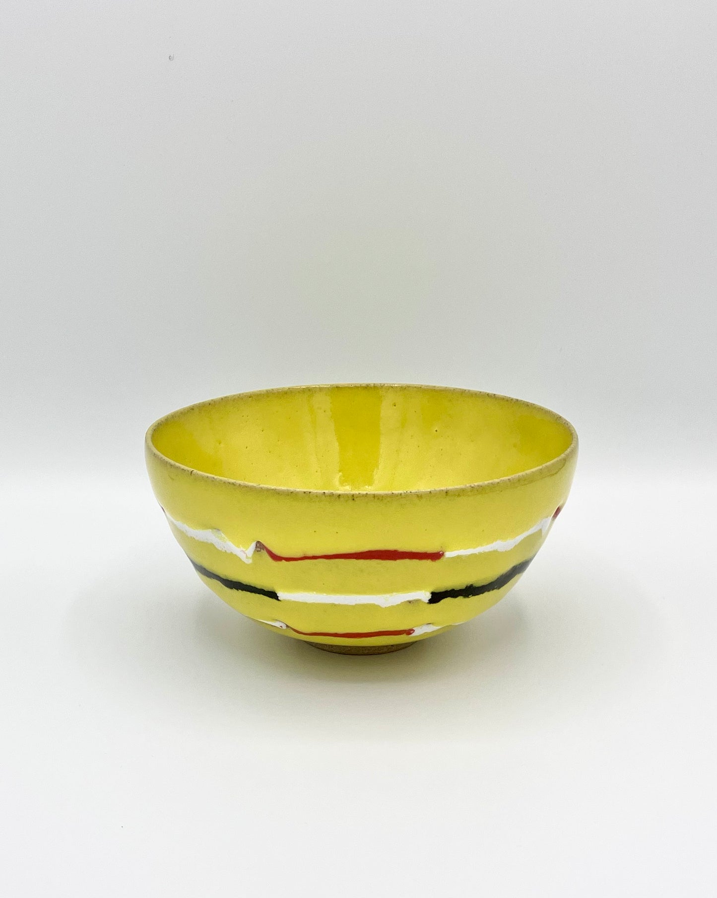 Yellow, red, white, black breakfast bowl