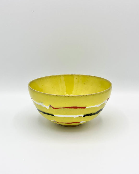 Yellow, red, white, black breakfast bowl
